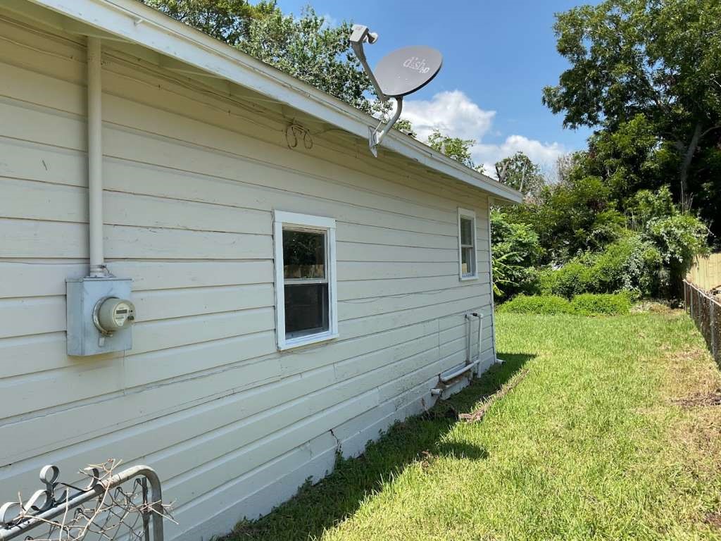 1156 2nd Street Clute, TX 77531 - Photo 12 of 15 a front view of a house with garden