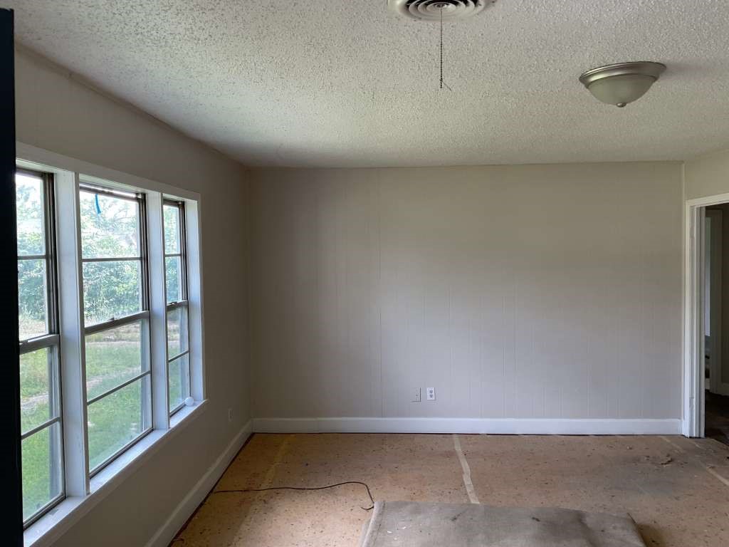 1156 2nd Street Clute, TX 77531 - Photo 2 of 15 an empty room with a window