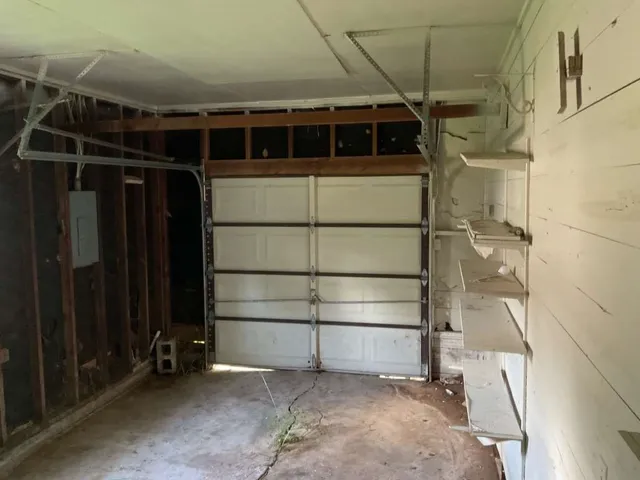 a view of an empty room with a glass door