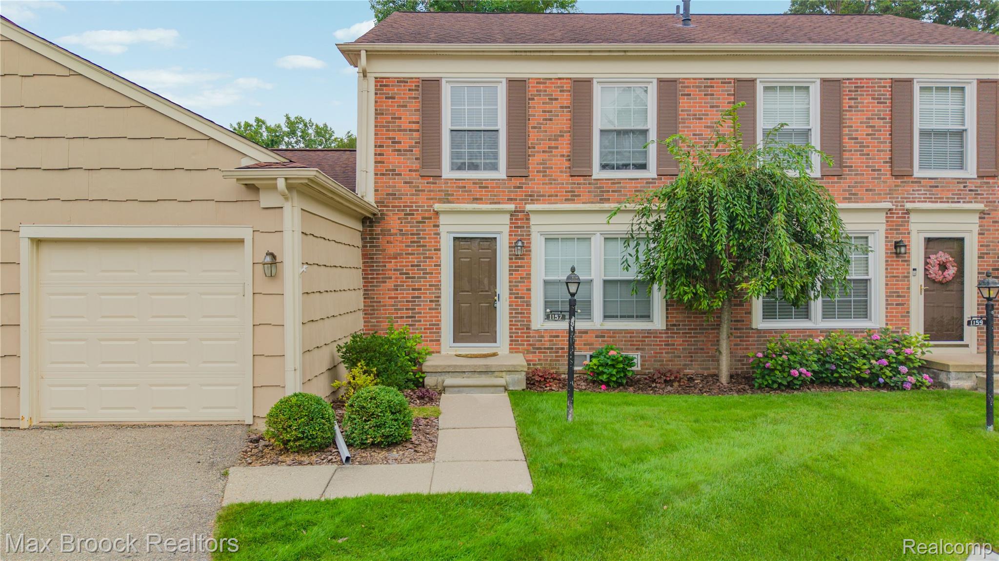 1157 Pine Ridge Court Rochester, MI 48306 - Photo 37 of 55 Charming Colonial brick exterior with symmetrical facade and multiple windows providing natural light throughout