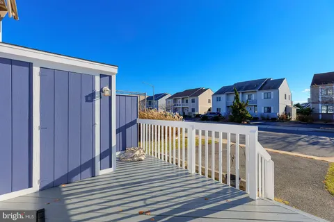 a view of a balcony with wooden fence