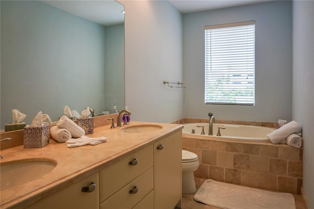 514 North Birch Road, Unit 514 Fort Lauderdale, FL 33304 - Photo 11 of 24 a bathroom with a granite countertop toilet and a sink