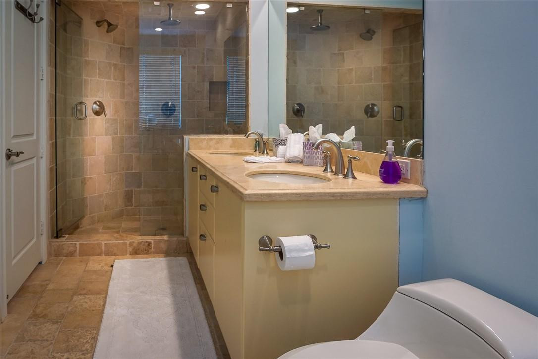 514 North Birch Road, Unit 514 Fort Lauderdale, FL 33304 - Photo 12 of 24 a bathroom with a sink a toilet and shower