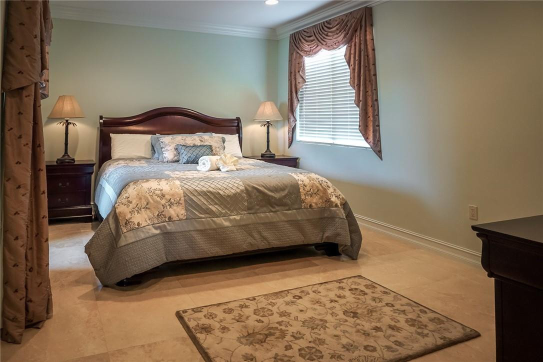 514 North Birch Road, Unit 514 Fort Lauderdale, FL 33304 - Photo 13 of 24 a bedroom with a bed and window