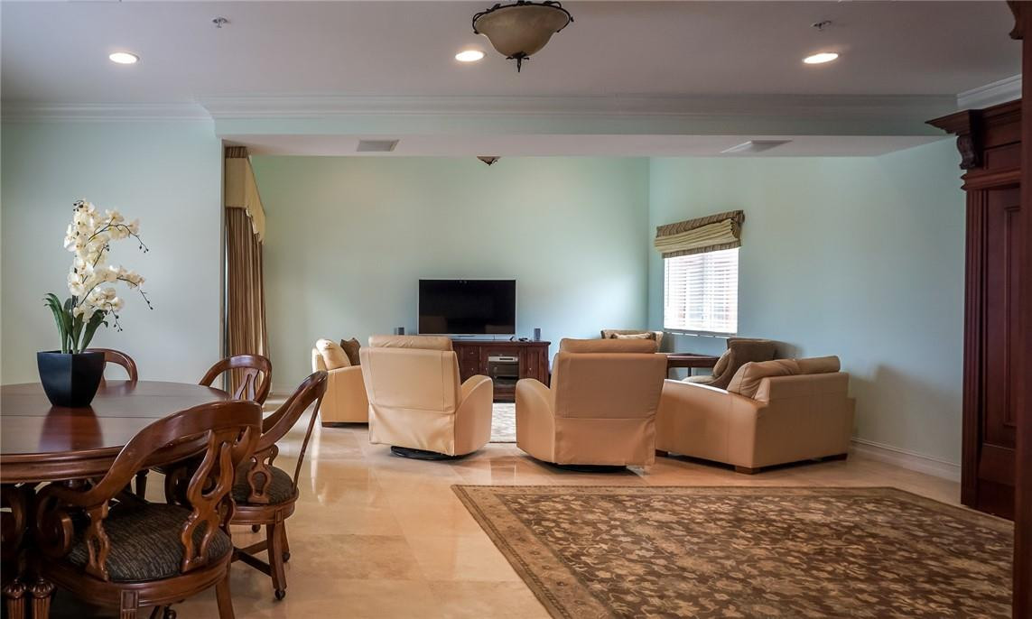 514 North Birch Road, Unit 514 Fort Lauderdale, FL 33304 - Photo 16 of 24 a living room with furniture and a flat screen tv