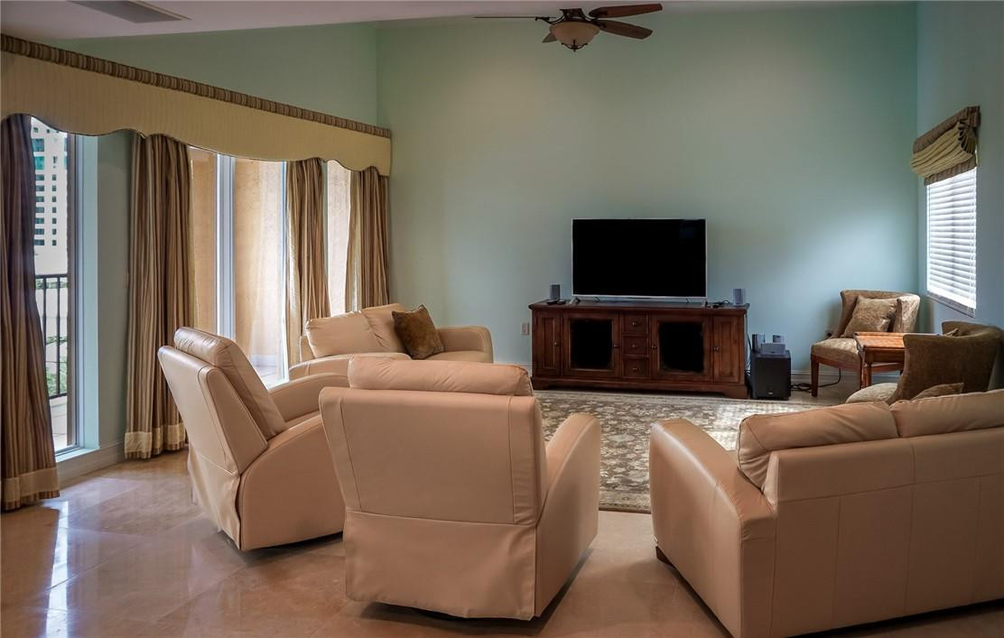 514 North Birch Road, Unit 514 Fort Lauderdale, FL 33304 - Photo 17 of 24 a living room with furniture and a flat screen tv