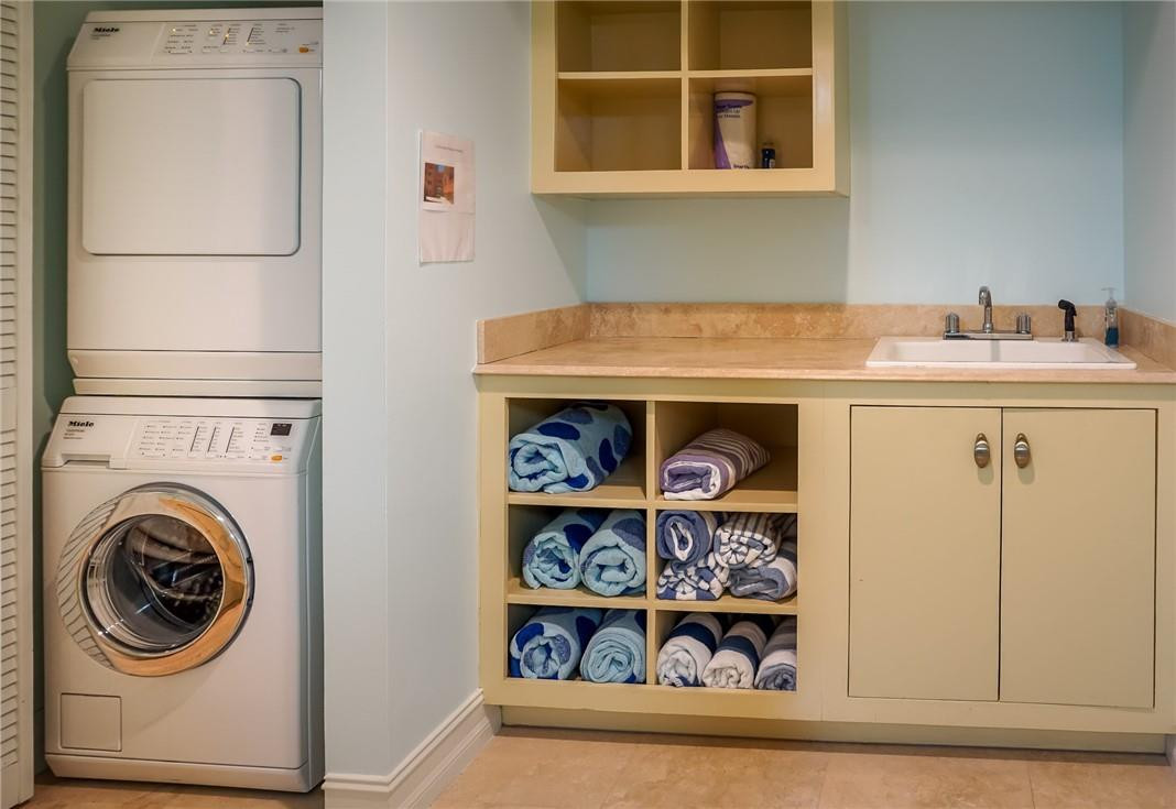 514 North Birch Road, Unit 514 Fort Lauderdale, FL 33304 - Photo 18 of 24 a utility room with sink dryer and washer