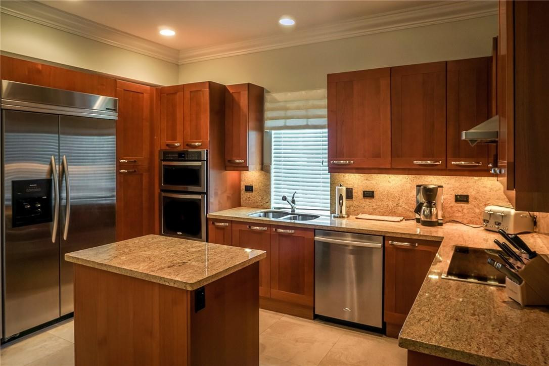 514 North Birch Road, Unit 514 Fort Lauderdale, FL 33304 - Photo 4 of 24 a kitchen with a sink and cabinets