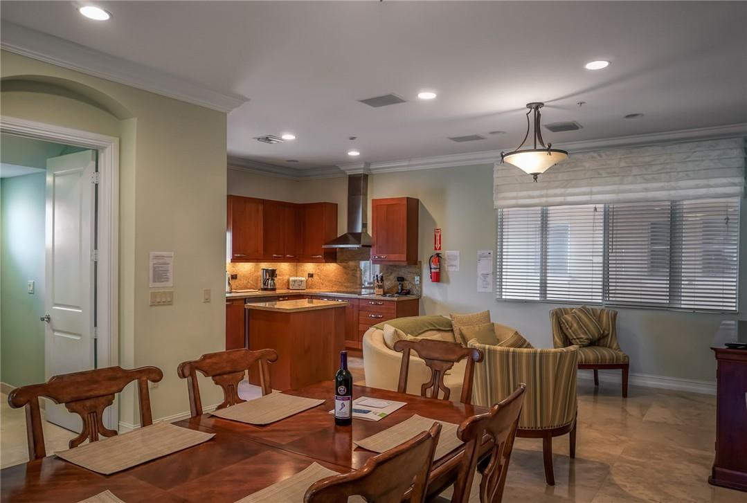 514 North Birch Road, Unit 514 Fort Lauderdale, FL 33304 - Photo 5 of 24 a living room with furniture a dining table and chairs
