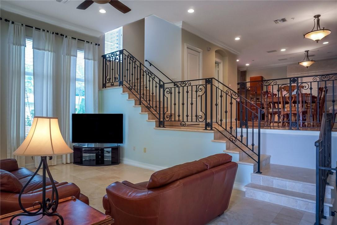 514 North Birch Road, Unit 514 Fort Lauderdale, FL 33304 - Photo 6 of 24 a living room with furniture and a flat screen tv