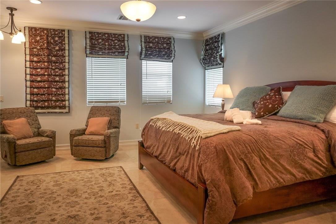 514 North Birch Road, Unit 514 Fort Lauderdale, FL 33304 - Photo 9 of 24 a spacious bedroom with a bed couch and a window