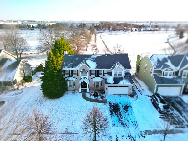 a view of a house with pool and lake view