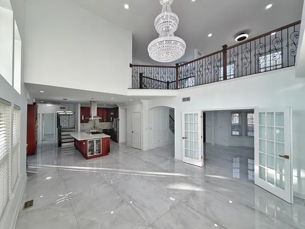 a kitchen with granite countertop stainless steel appliances and wooden cabinets