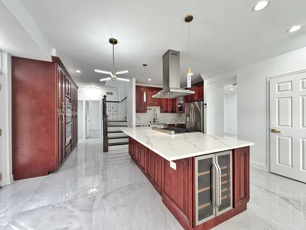 a kitchen with cabinets and window