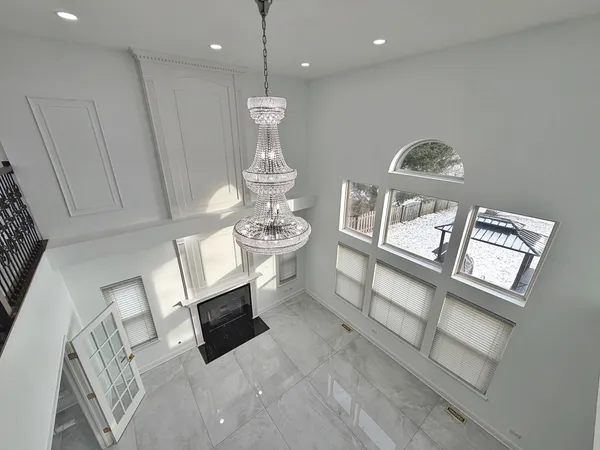 an empty room with windows and closet