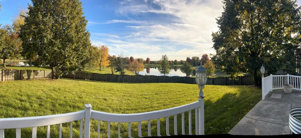 an aerial view of a residential houses with outdoor space