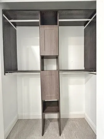 a bathroom with a double vanity sink mirror and shower