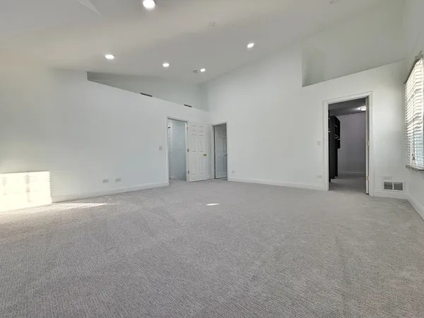 a spacious bathroom with a double vanity sink and mirror