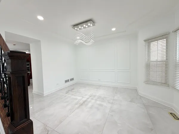 a view of entryway livingroom and hall with wooden floor