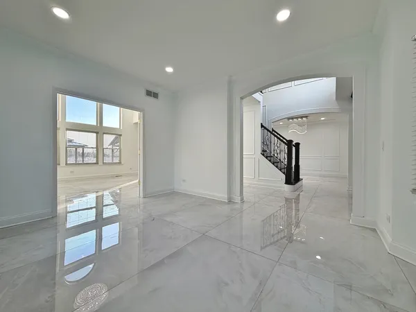 a view of an entryway with chandelier