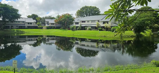 a view of a lake with a building in the background