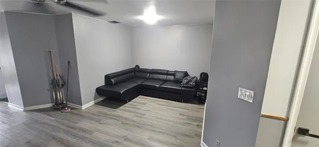 a bedroom with a bed and a mirror