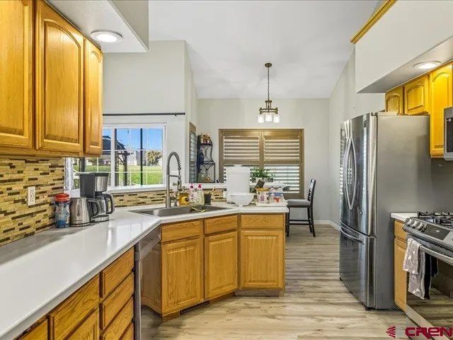 a kitchen with lots of counter space and appliances
