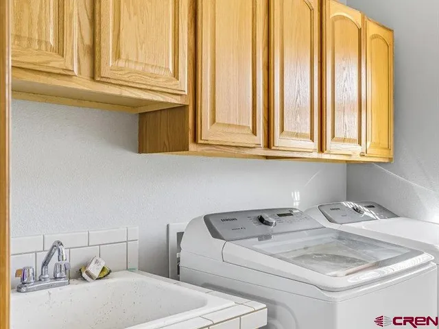 a bathroom with a sink and a window