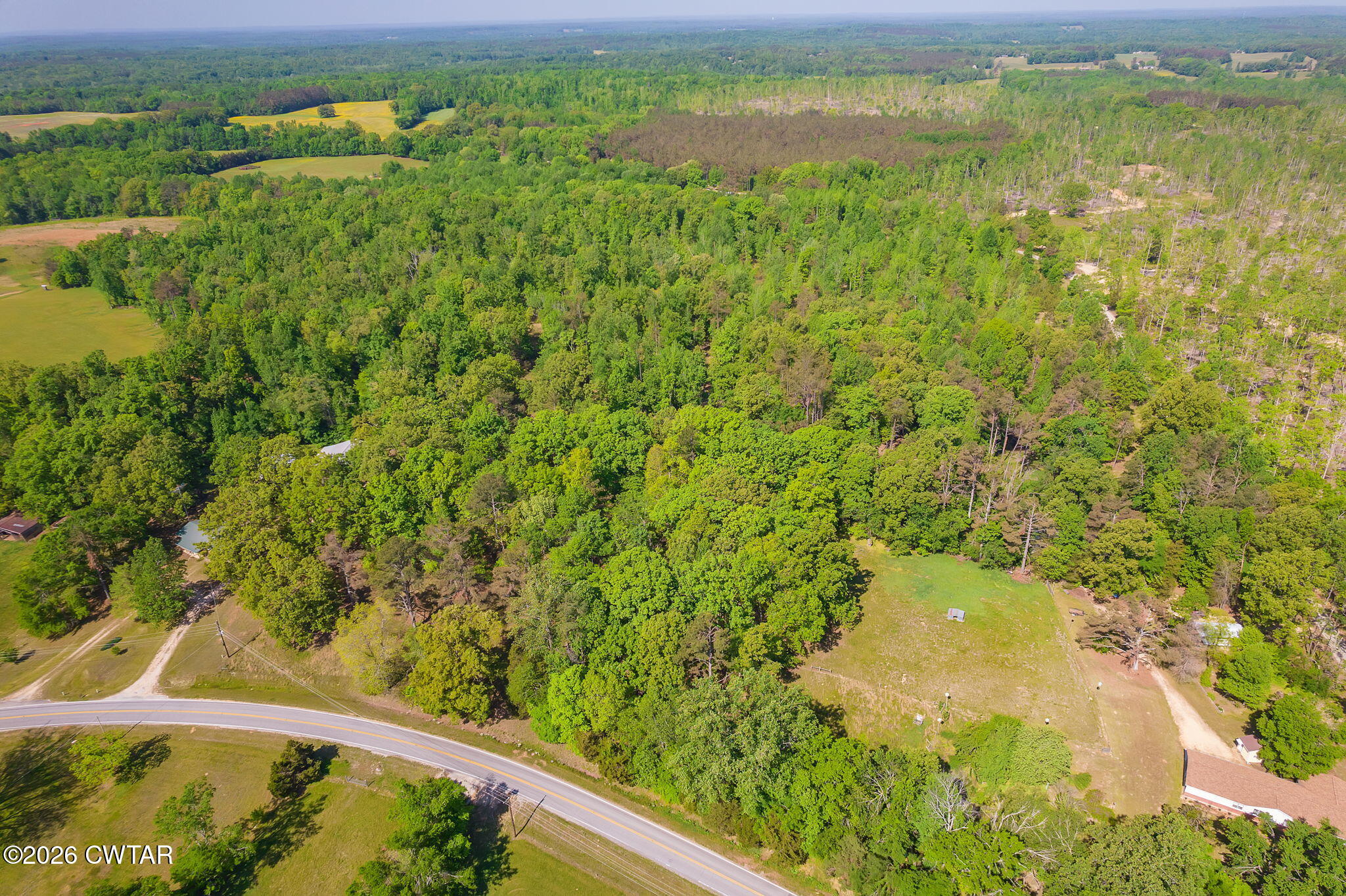 9402 Brooksie Thompson Road Bath Springs, TN 38311 - Photo 6 of 19 a view of a lake from a yard