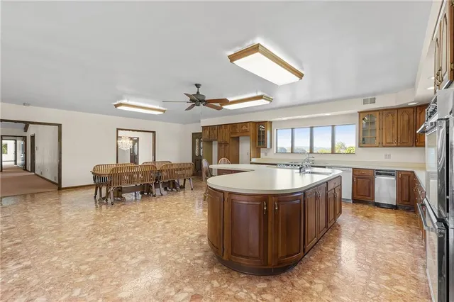 a bathroom with a sink a vanity and a large mirror