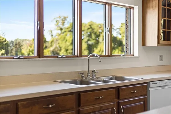 a dining room with furniture window and outside view