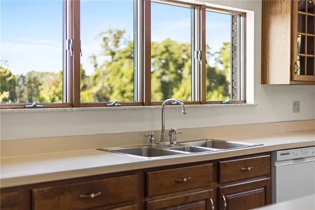 a dining room with furniture window and outside view