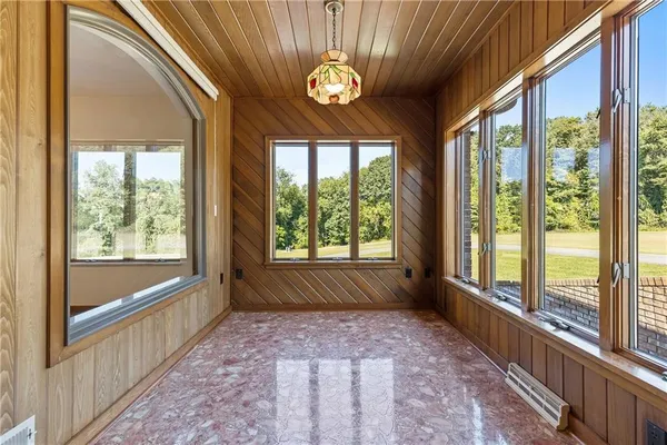 a dining room with furniture water view and balcony