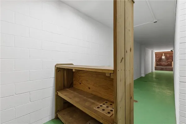 a view of a hallway with stairs