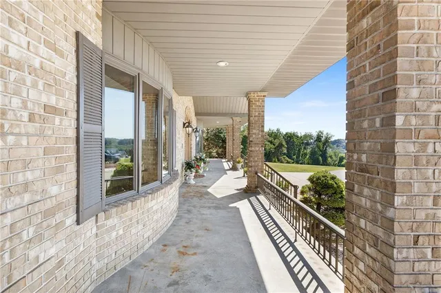 an outdoor space with pool and furniture