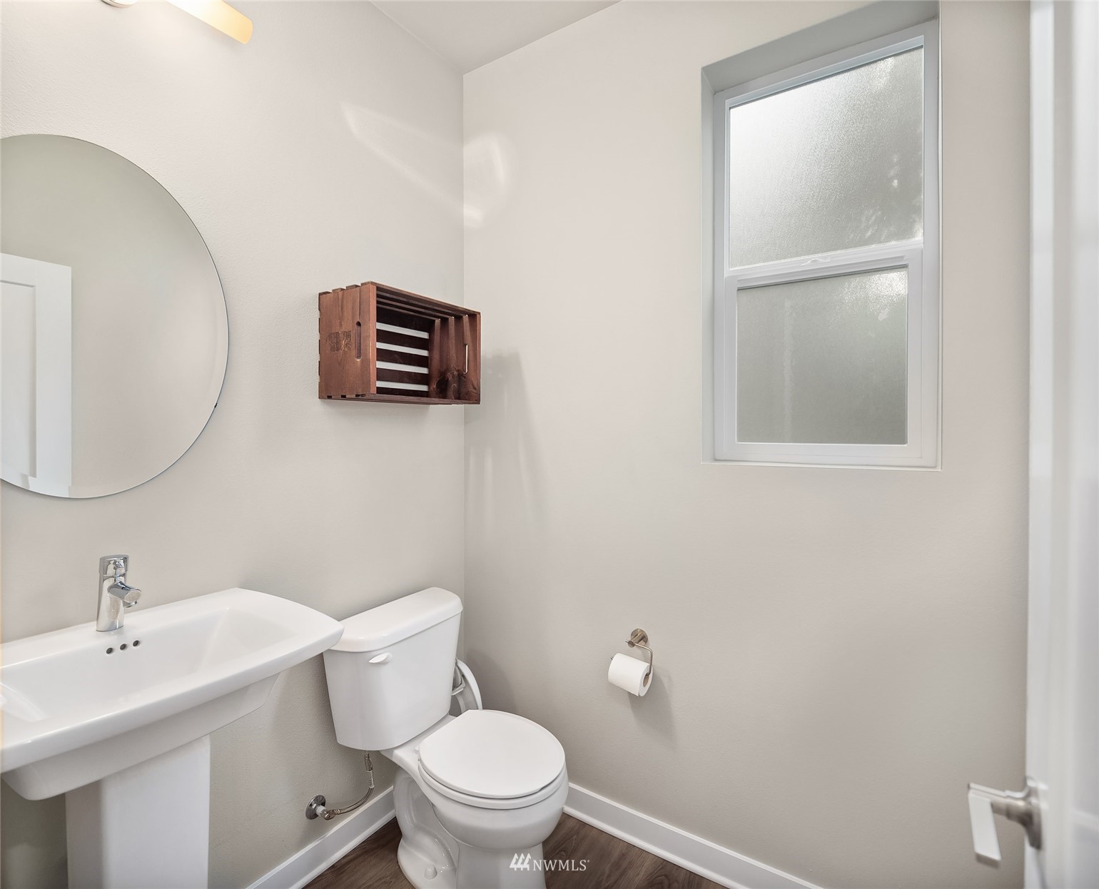 2002 101st Avenue Southeast, Unit 2 Lake Stevens, WA 98258 - Photo 15 of 22 a bathroom with a toilet a sink and mirror