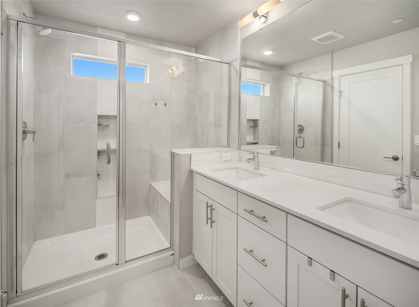 2002 101st Avenue Southeast, Unit 2 Lake Stevens, WA 98258 - Photo 22 of 22 a bathroom with a shower sink and mirror