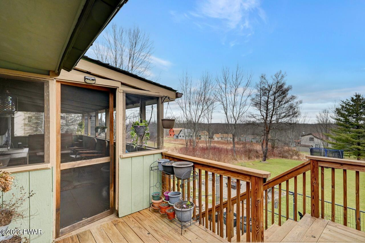 1597 Ridgeview Drive Lake Ariel, PA 18436 - Photo 54 of 92 a view of balcony with wooden floor and outdoor seating