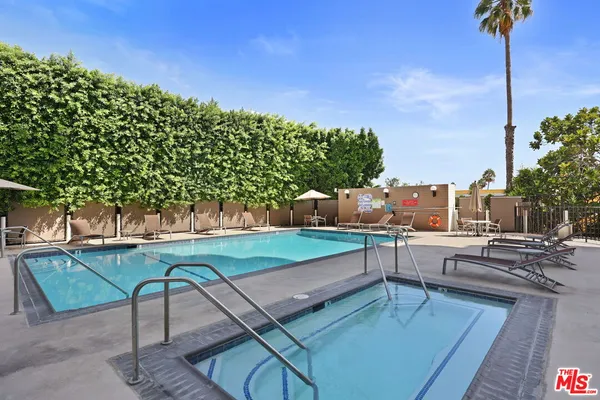a view of a swimming pool with a bench