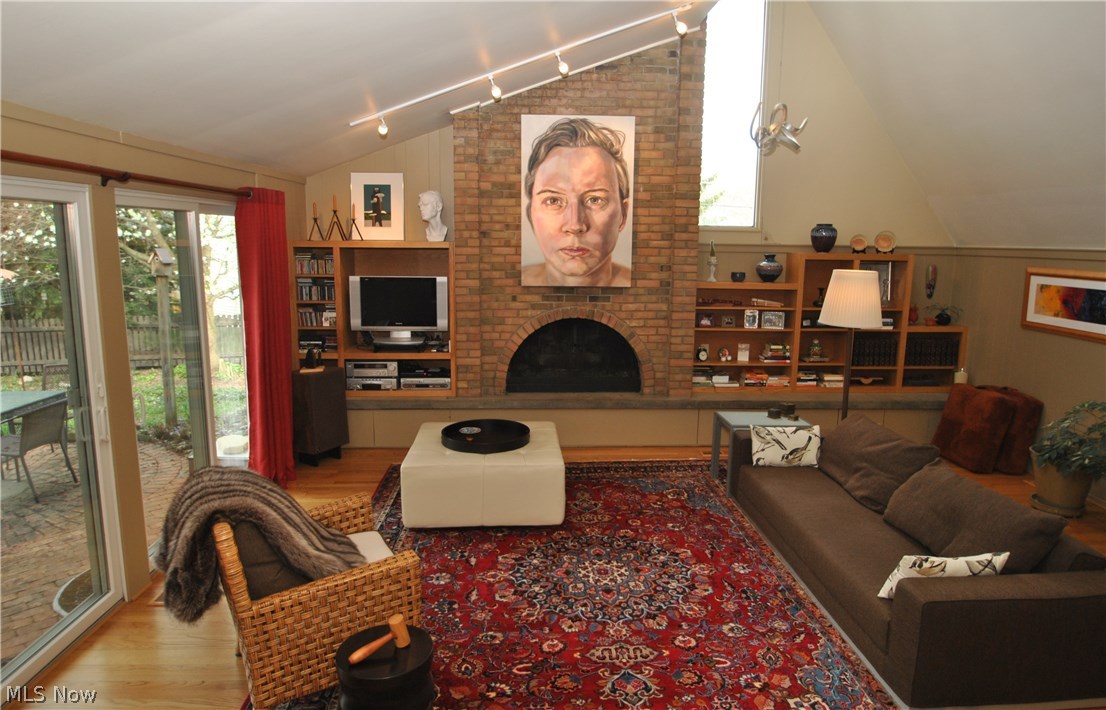 2881 Bellaire Road Silver Lake, OH 44224 - Photo 5 of 29 This stunning family room addition with its vaulted ceiling showcases a two story brick fireplace with flanking bookshelves.