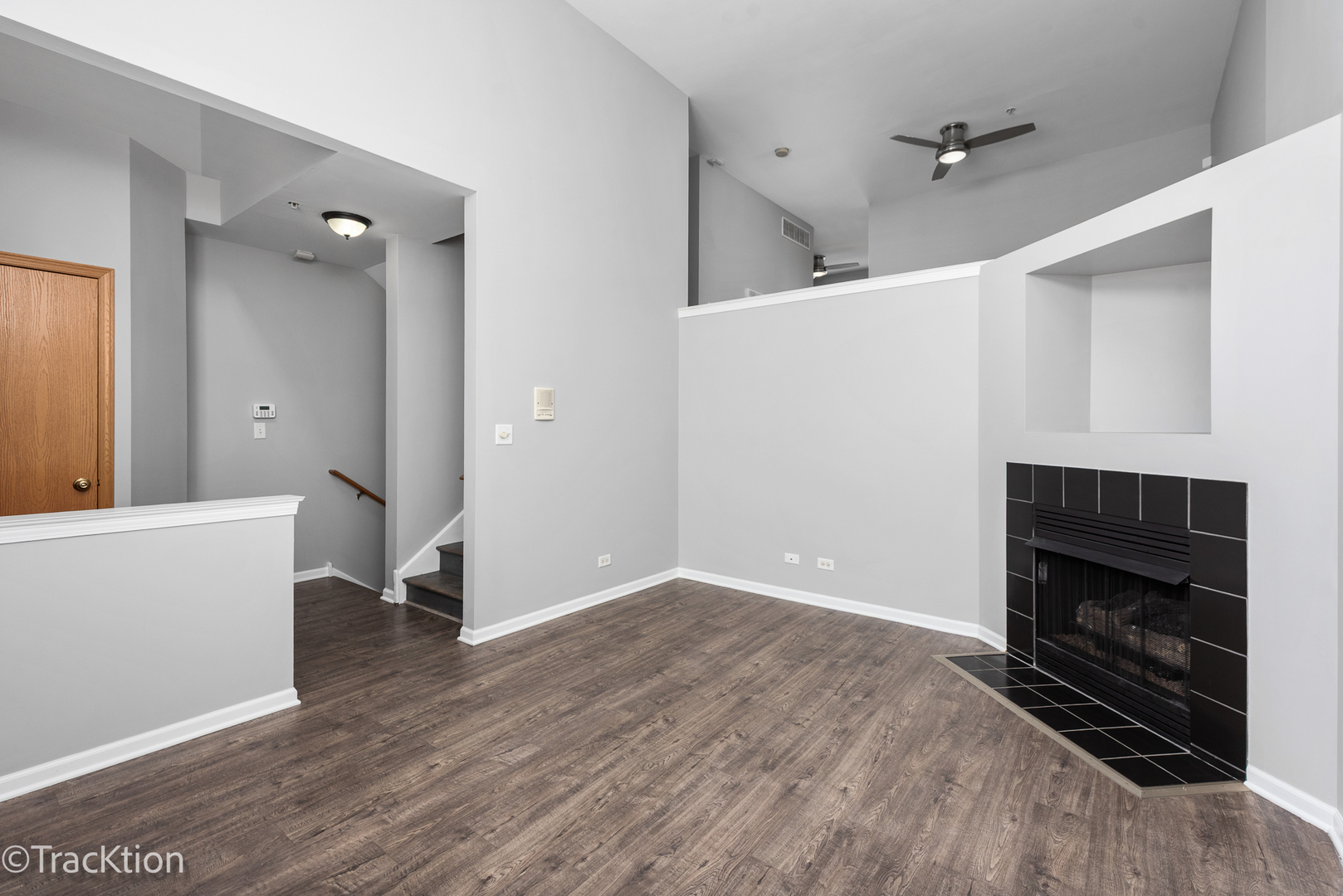 21602 Dogwood Road, Unit 1184 Matteson, IL 60443 - Photo 3 of 15 a view of an empty room with wooden floor and a fireplace