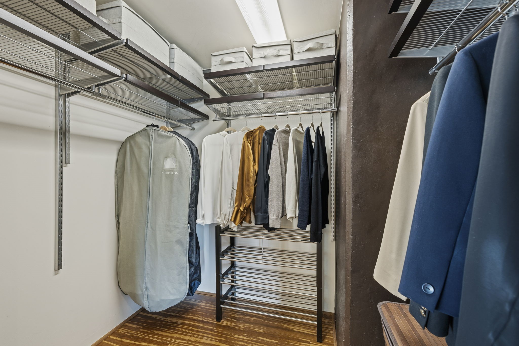 2000 Bagby Street, Unit 11415 Houston, TX 77002 - Photo 18 of 35 Well designed walk-in closet with bamboo flooring, custom shelving, and generous hanging space to organize all of your wardrobe needs.