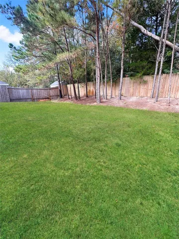 a view of a back yard of the house
