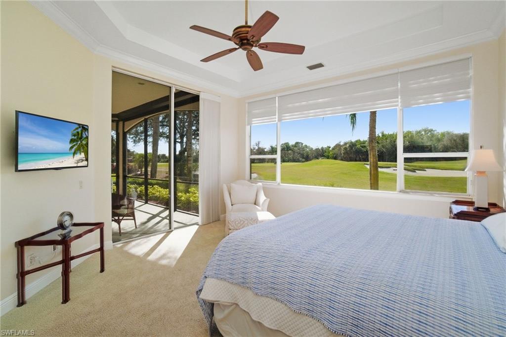 17015 Porta Vecchio Way, Unit 101 Naples, FL 34110 - Photo 12 of 39 a bedroom with a bed and a view of balcony