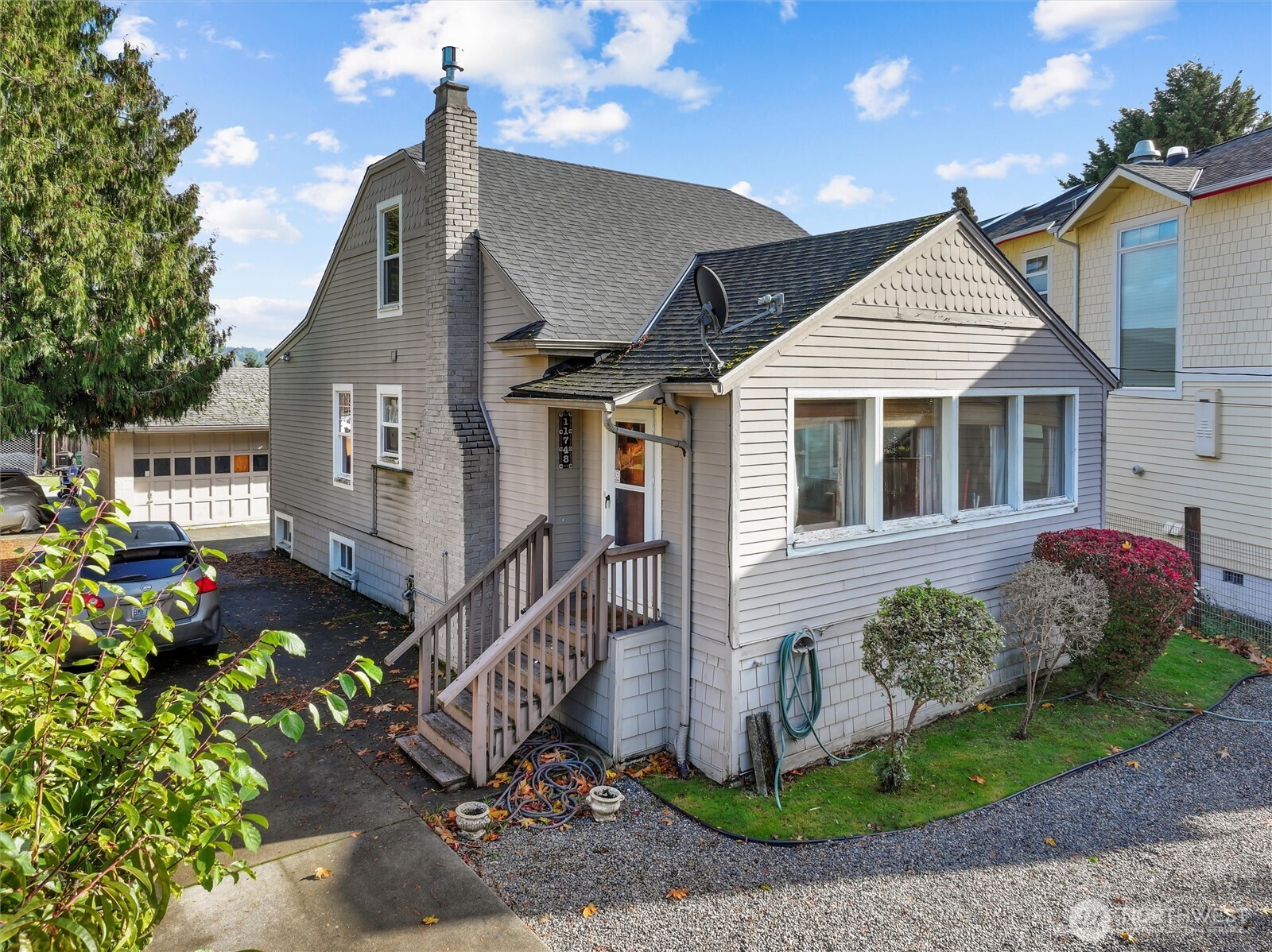 11748 Sand Point Way Northeast Seattle, WA 98125 - Photo 1 of 9 a view of a house with a yard