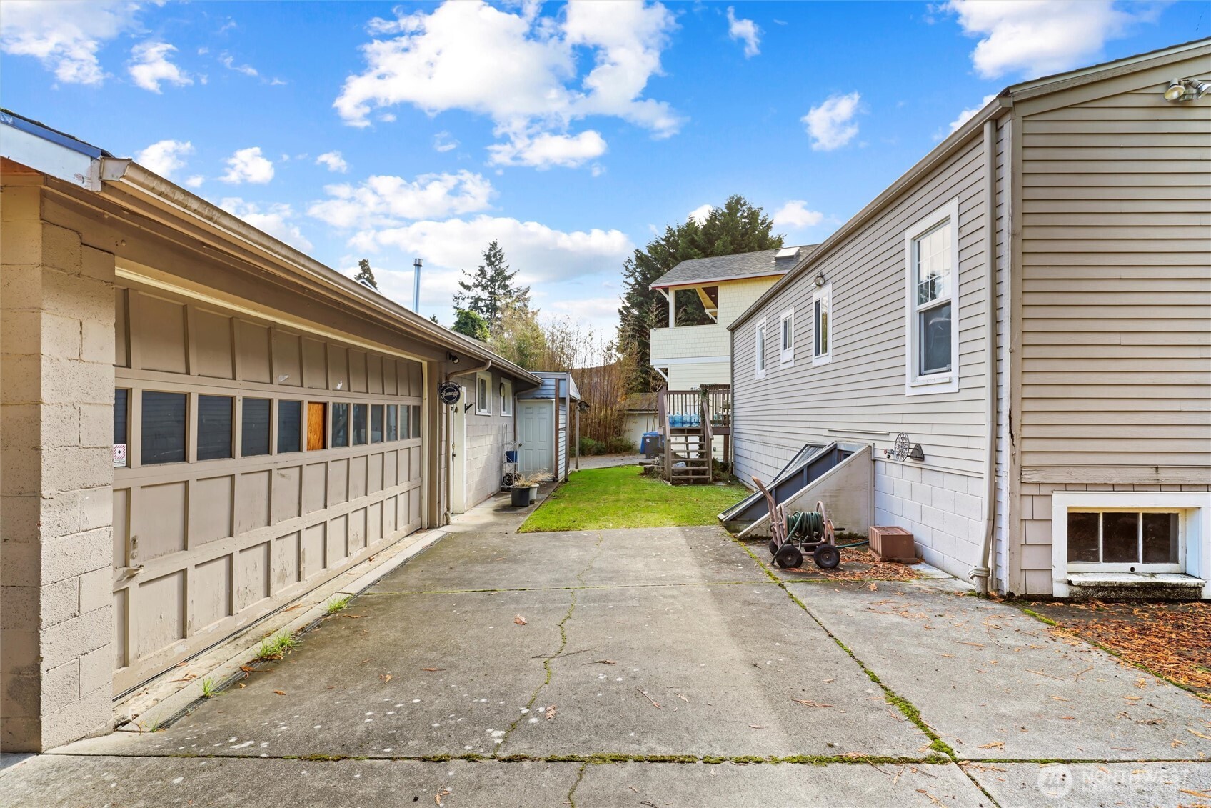 11748 Sand Point Way Northeast Seattle, WA 98125 - Photo 5 of 9 a view of a house with a backyard