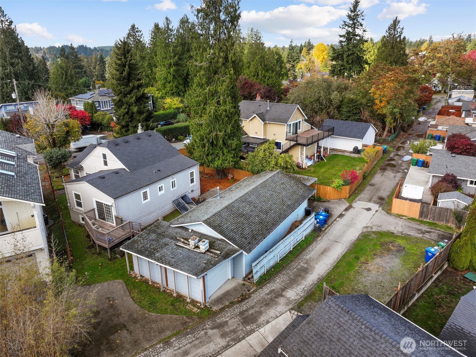11748 Sand Point Way Northeast Seattle, WA 98125 - Photo 6 of 9 an aerial view of a house with a garden and trees