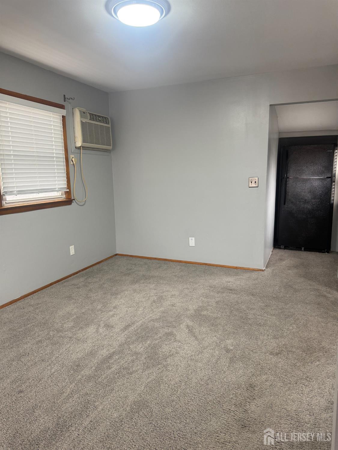 55 Murdock Street Fords, NJ 08863 - Photo 4 of 6 a view of an empty room with a window
