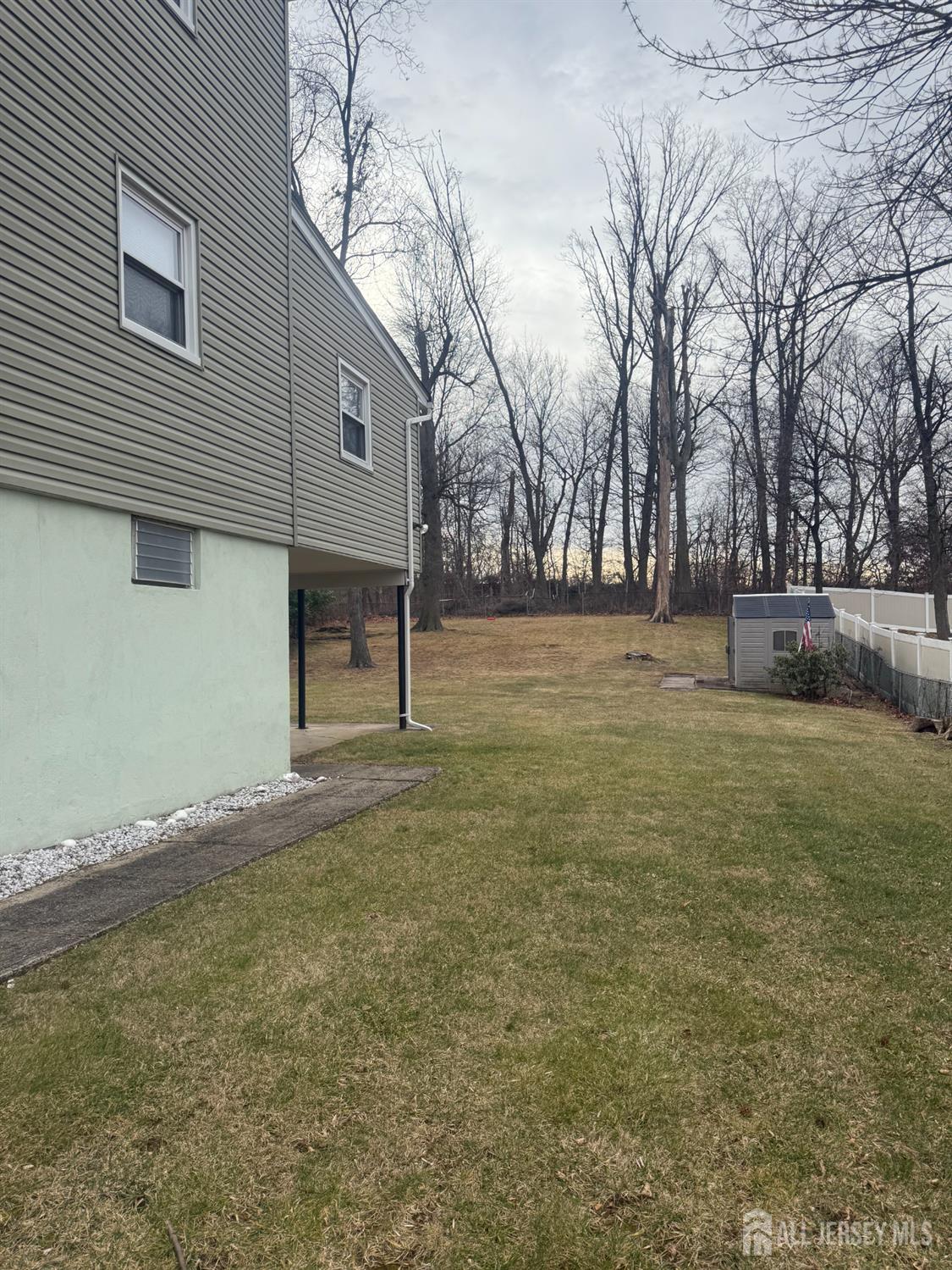 55 Murdock Street Fords, NJ 08863 - Photo 6 of 6 a view of a yard with a large tree
