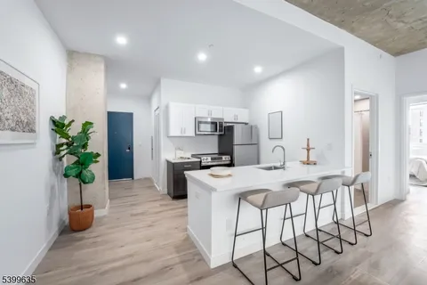 a kitchen with a table and chairs in it